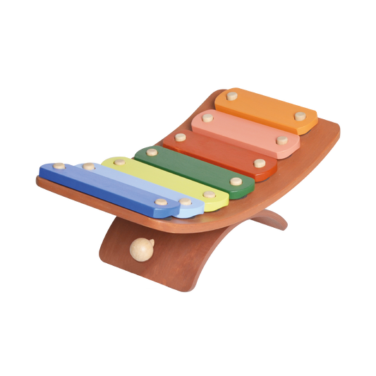 A wooden xylophone with seven colored keys on a curved wooden stand.