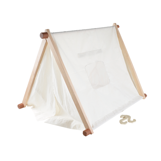 A white play tent with an open door flap, set up outdoors. The tent is made of a lightweight, breathable fabric and has wooden poles.