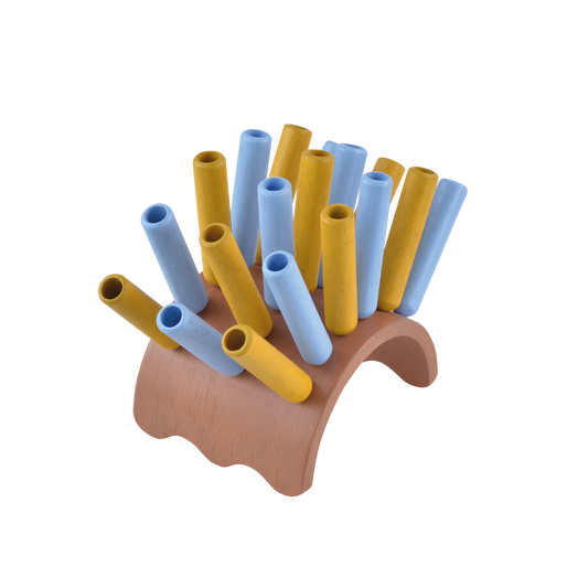 A wooden percussion instrument resembling a sea urchin, with yellow and blue plastic sticks arranged in a circle.