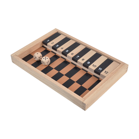 A wooden 'Shut the Box' game with dice and numbered game tiles on a wooden board.