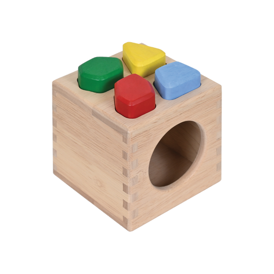 A wooden sound stones sorter box with four colorful irregular shaped pieces inside.