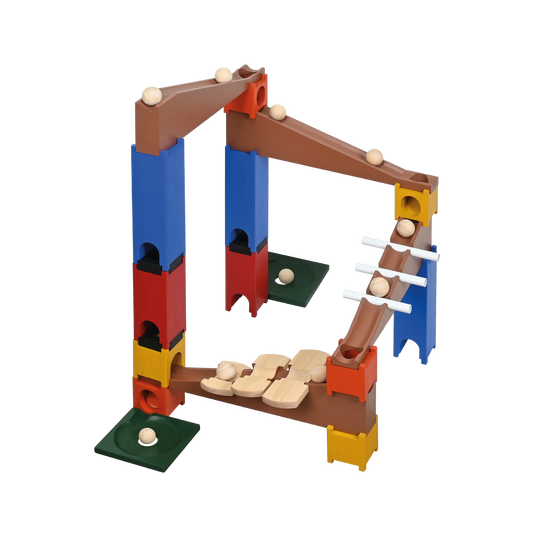 A colorful marble run ramp set with various inclined tracks and interlocking blocks, including a wooden ball and marbles in motion.