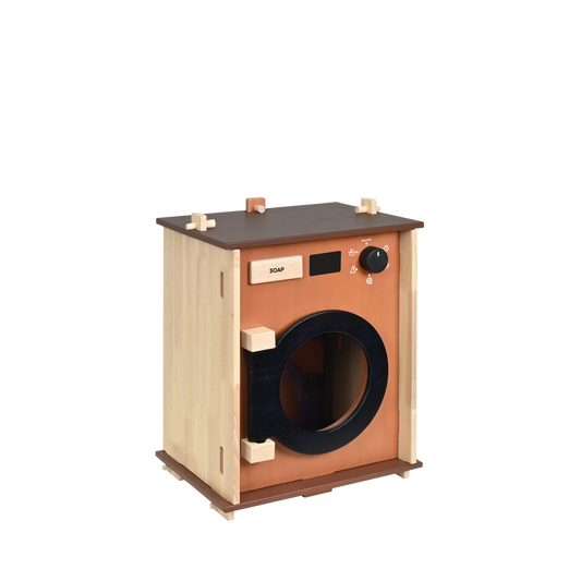 A children's washing machine toy made of wood, with a brown finish and a dark door resembling a real washing machine.