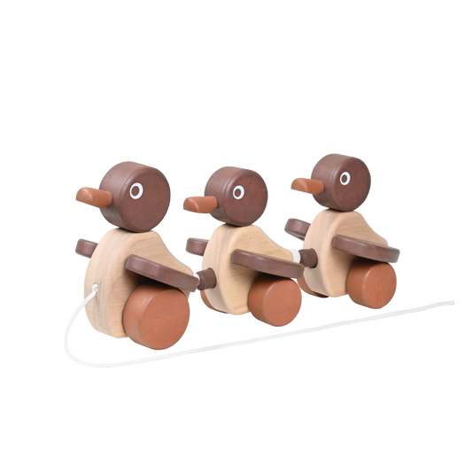 Three wooden ducks on a string. Wooden toys for toddler.
