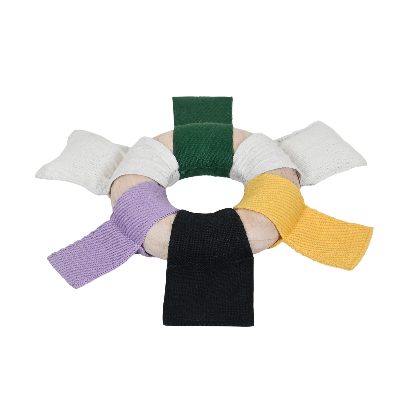 A circular ribbon ring with alternating black, white, and green ribbons attached to it. Each ribbon is a different color and the ring is smooth and wooden.