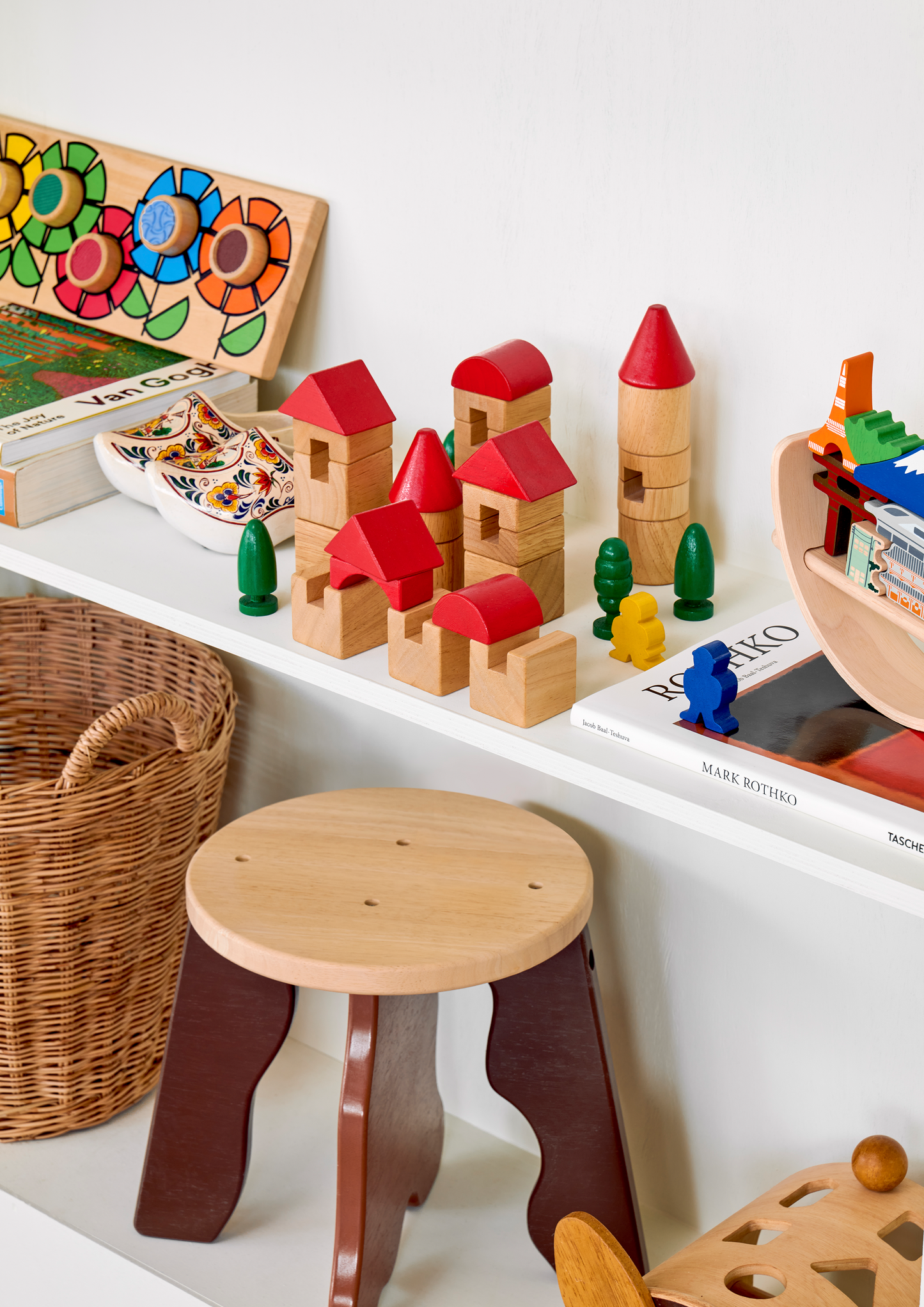 A balancing toy set inspired by the Tokyo cityscape, featuring various iconic landmarks placed on a crescent-shaped base which can rock when touched.