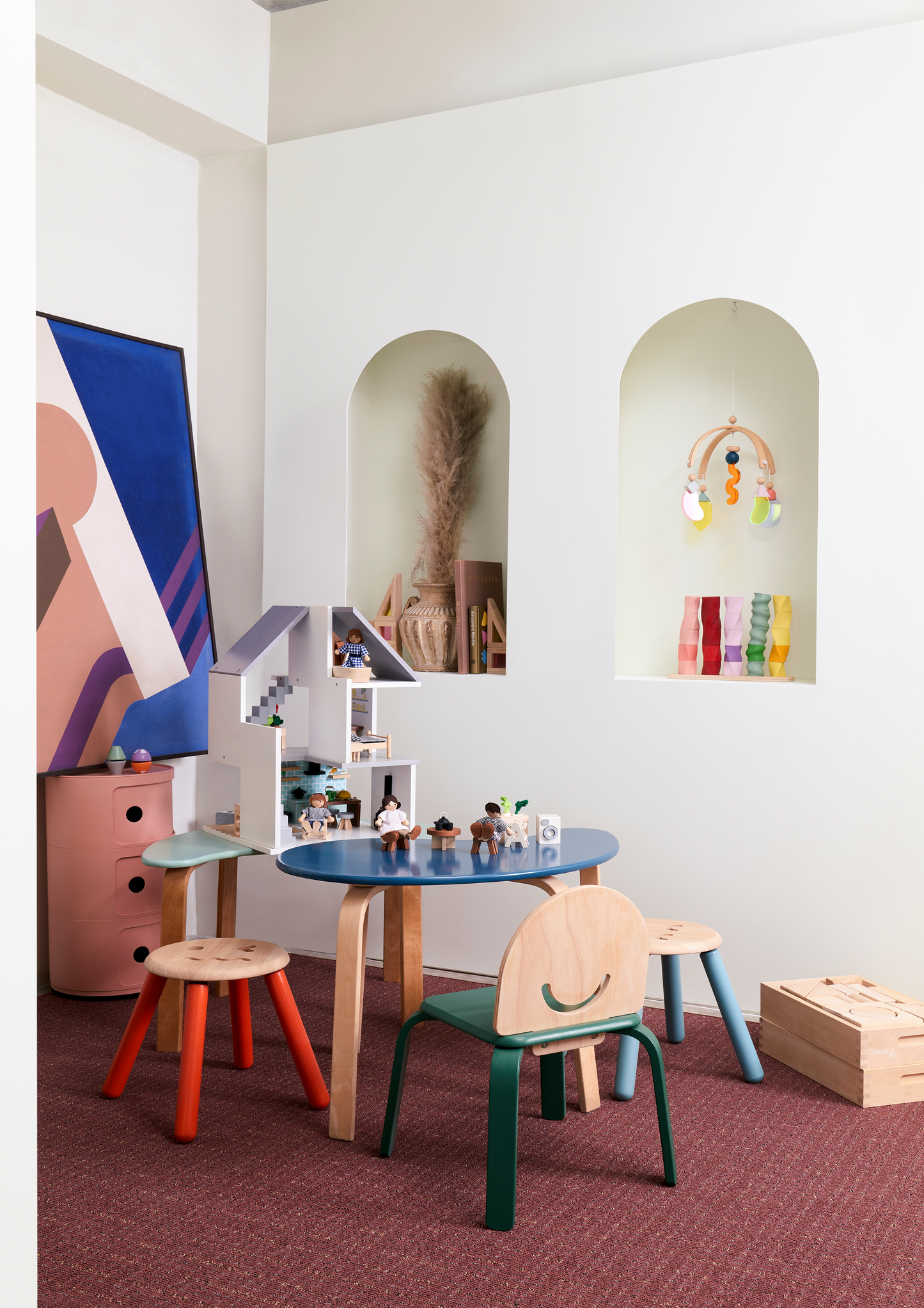 Children's chair with a smiley face design on the backrest and blue frame.