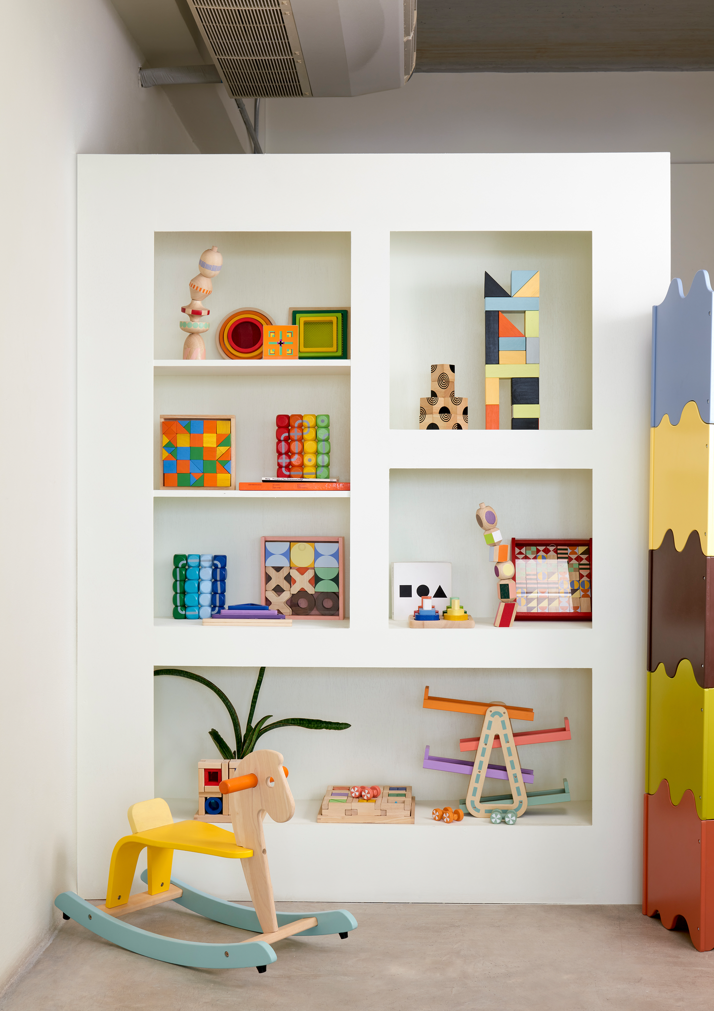 Arrange smaller blocks into the matching grooves of larger blocks to explore and understand the relative sizes and shapes.