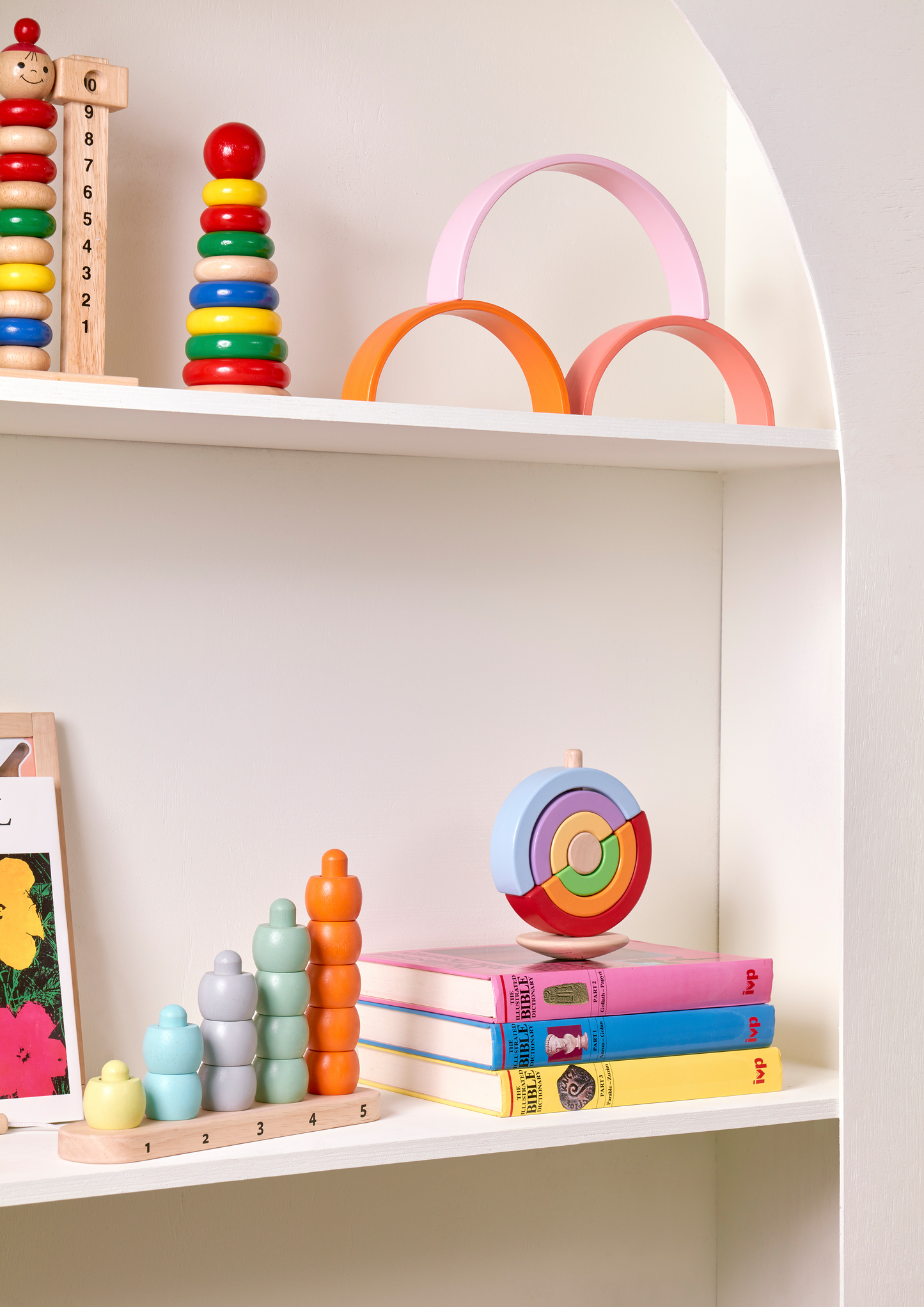 A set of colorful, plastic construction arches in shades of pink and white, intended for children's play and creativity.