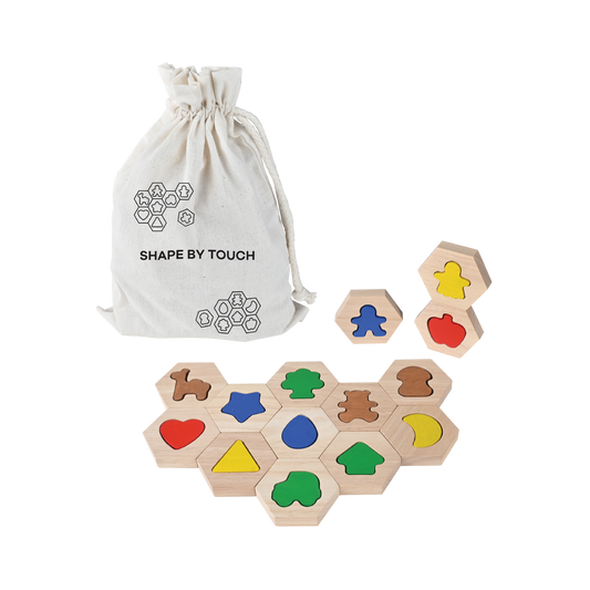 Wooden hexagon blocks with precisely cut shapes for fitting, helping children identify shapes and distinguish differences.