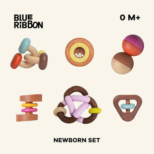 Newborn gift set with natural rubberwood rattles, designed for shaking and grasping. Safe non-toxic colors, enhances fine motor skills, and features gentle sounds for sensory exploration. Easy to sanitize and UV clean.