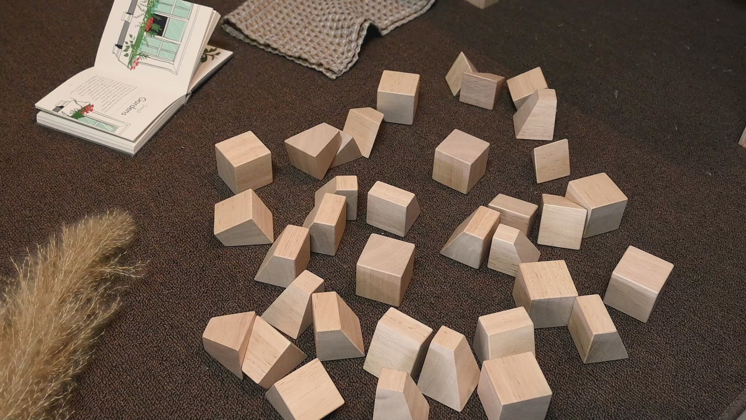 A pyramid-shaped stack of wooden blocks.