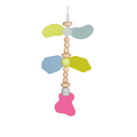 A colorful hanging baby toy with geometric shapes in blue, yellow, and pink, along with beads and a bell.