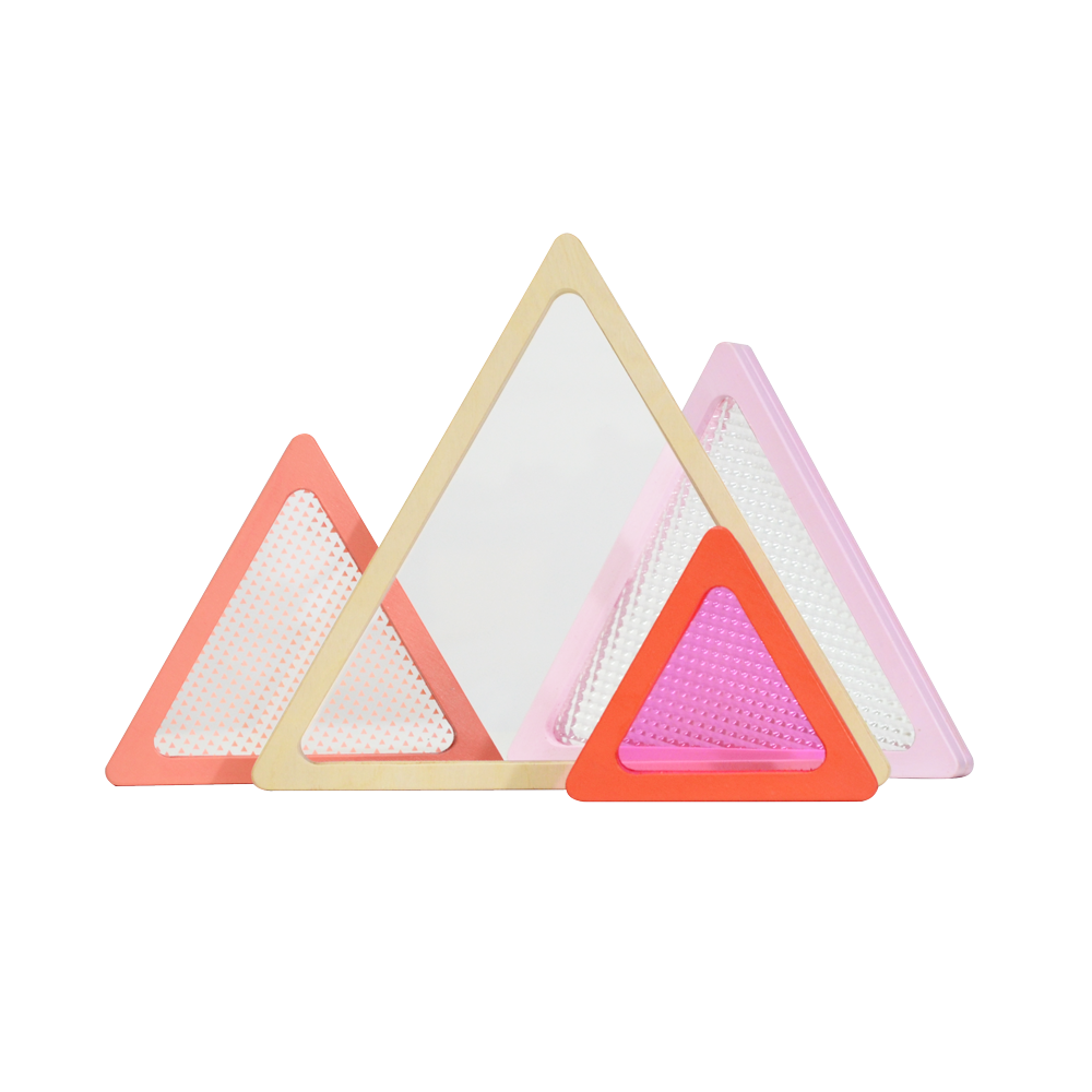 A geometric wooden block toy with triangular and rectangular pieces in various shades of pink, beige, and dark colors.