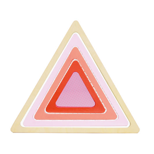 A geometric wooden block toy with triangular and rectangular pieces in various shades of pink, beige, and dark colors.