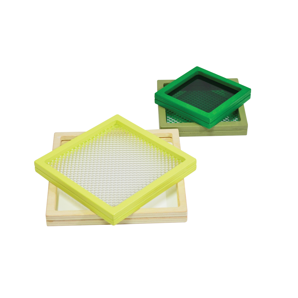 A multicolored geometric toy consisting of a square disc with different colors and patterns on each side, presented on a light background.