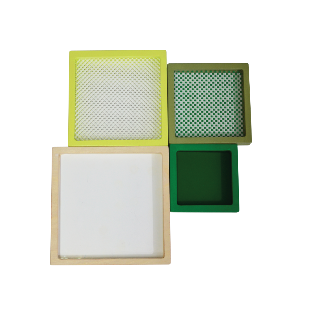 A multicolored geometric toy consisting of a square disc with different colors and patterns on each side, presented on a light background.