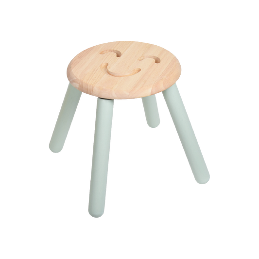A children's stool with a round seat featuring a smiling emoji face and solid wood legs in a light color.