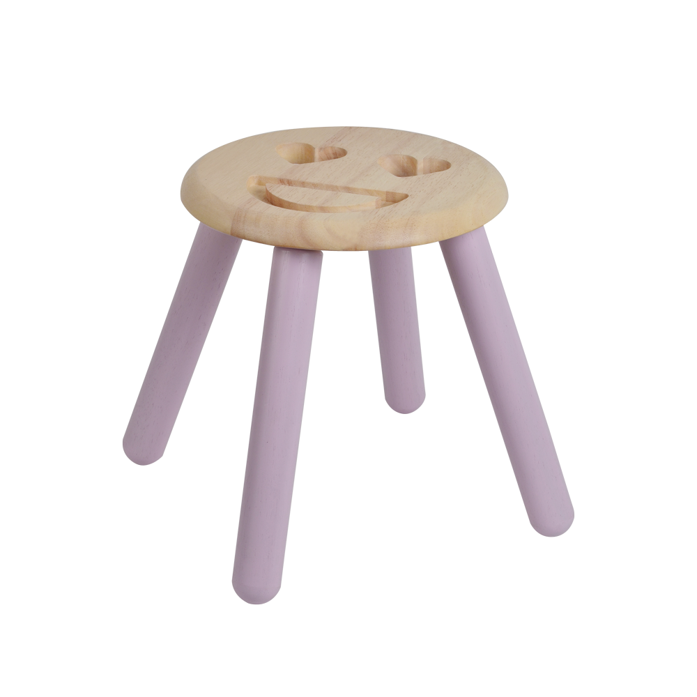 A small wooden stool with a smiley face design on the seat, having white tapered legs.