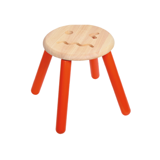 Children's stool with a beige round seat and orange tapered legs, featuring emoji-inspired facial expressions on the seat.