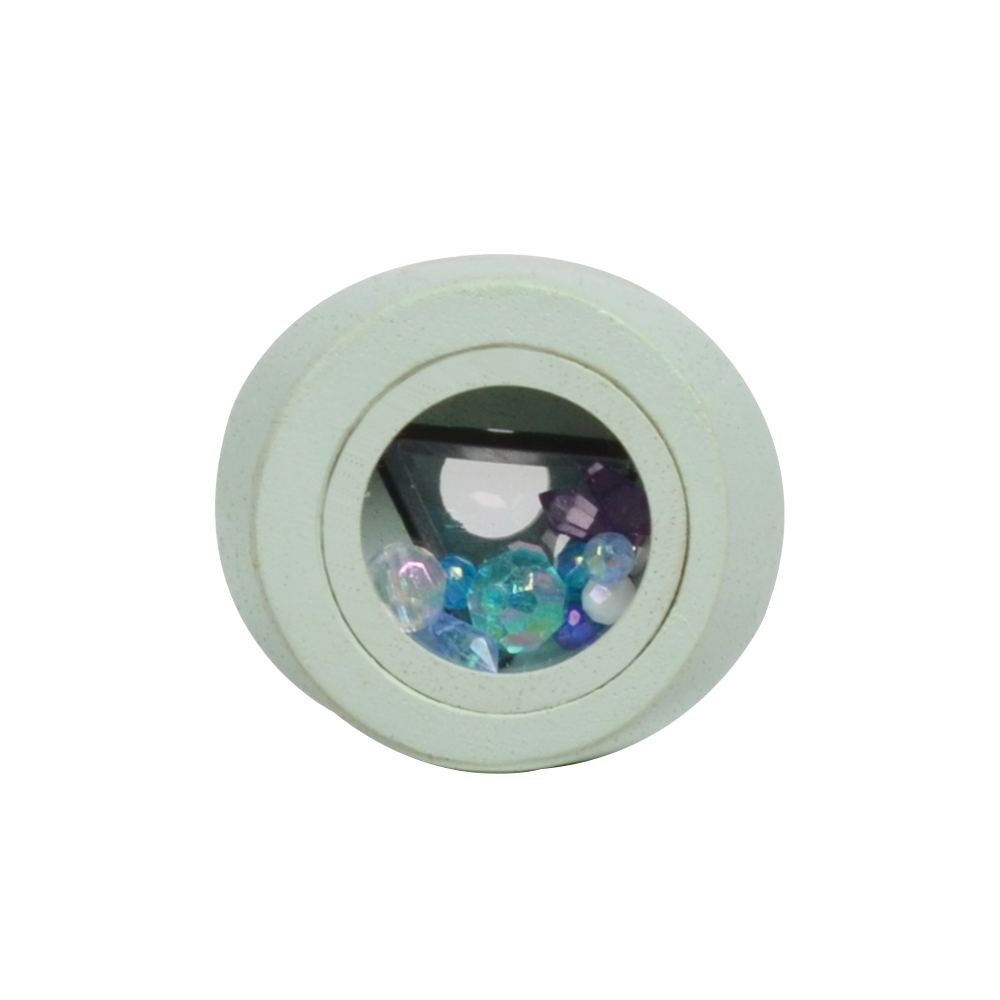 A white, irregularly shaped kaleidoscope toy.