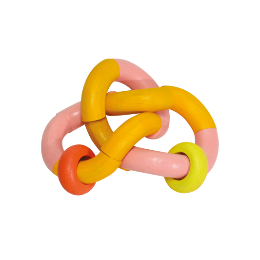 A colorful bendy rattle toy with orange, pink, and yellow parts connected by knots.