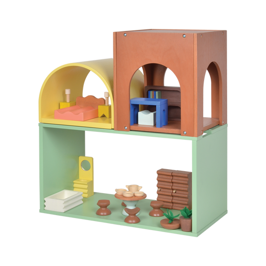 A colorful wooden dollhouse with multiple levels and rooms, furnished with miniature furniture and accessories.