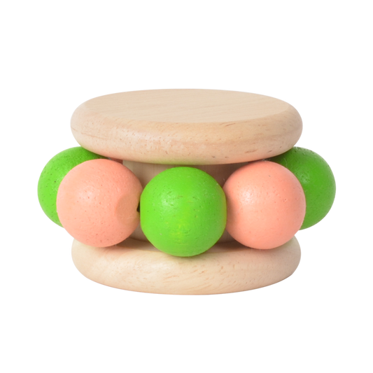 A wooden rattle with green and pink rounded elements, likely to make rattling sounds and provide tactile stimulation.