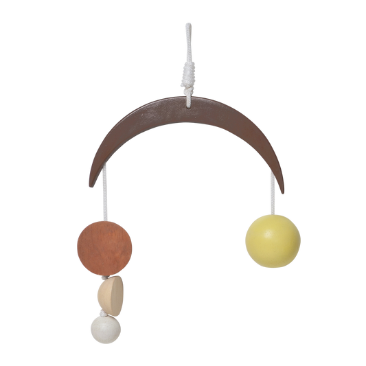 A baby mobile with a wooden arc, attached with colorful geometric shaped hanging elements in brown, beige, black, and white.