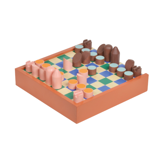 A double-sided chess checker board with pieces in various colors on a beige background, flipped to show the other side with a blue and white checkered pattern.