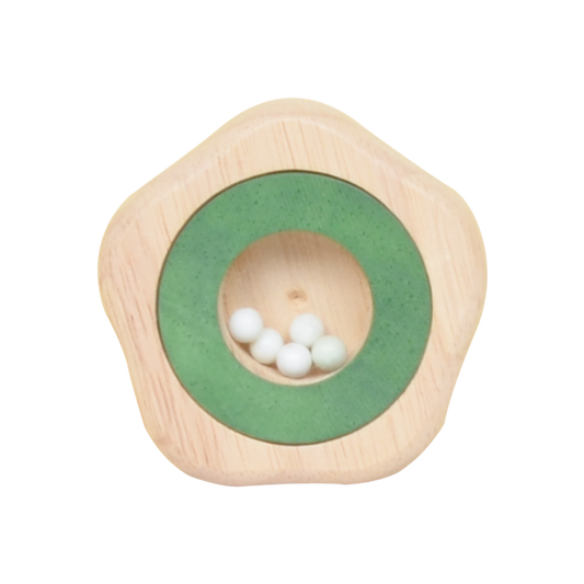 A wooden maraca shaped like a star with green and white colors, containing small white beads inside.