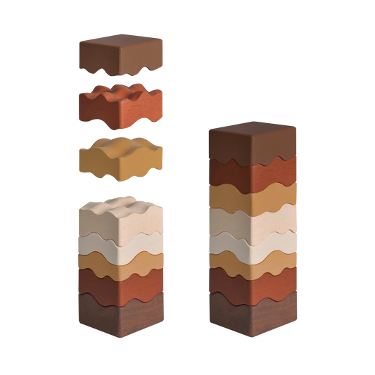 A series of four rammed earth puzzle blocks in different shades of brown, beige, and gray, designed to represent natural layers in a building structure.