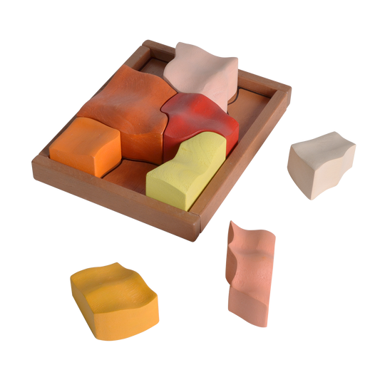 A colorful wooden puzzle with various shaped pieces displayed both in and out of a rectangular wooden tray.
