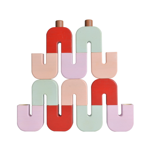 A pyramid structure made of colorful U-shaped blocks connected by dowels, with a variety of pastel colors.