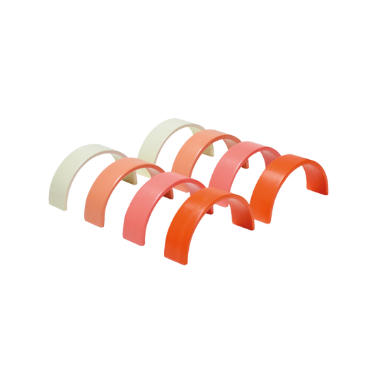 A set of colorful, plastic construction arches in shades of pink and white, intended for children's play and creativity.