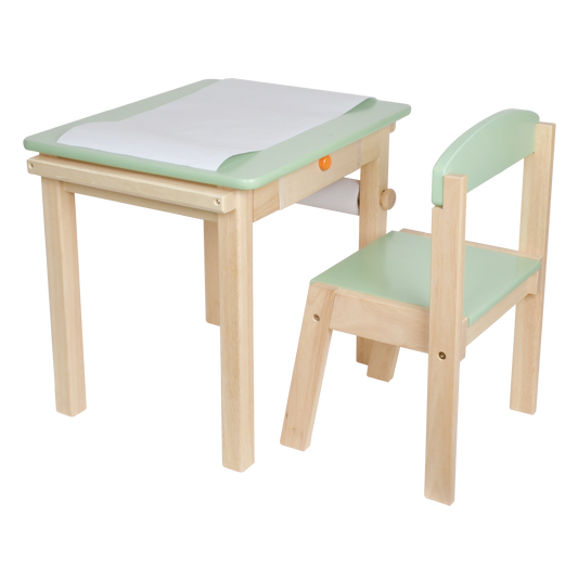 A small wooden desk with a green paper roll holder and a matching chair, designed for children.