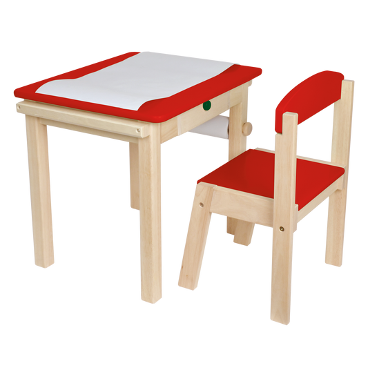 A small wooden desk with a red paper roll holder and cutter, and a matching wooden chair with a red seat cushion.