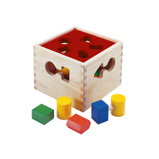 A wooden shape sorter box with various colored blocks inside, designed for young children to sort and match shapes.
