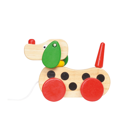 A colorful wooden toy in the shape of a dog with a wagging head, ears, and tail.