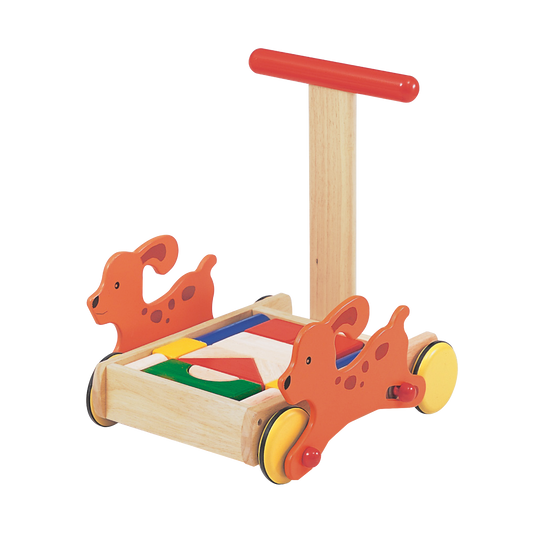 A wooden animated dog walker toy with red and orange accents, featuring a cart with wheels and a handle, and colorful blocks.