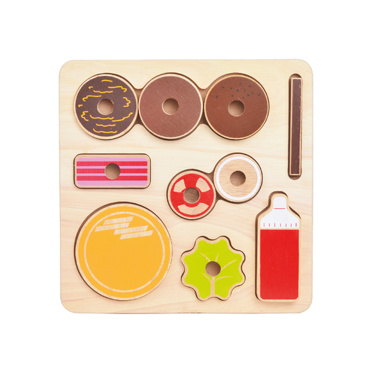 A wooden shape sorting toy with various circular shapes and a few non-circular shapes, intended for young children.