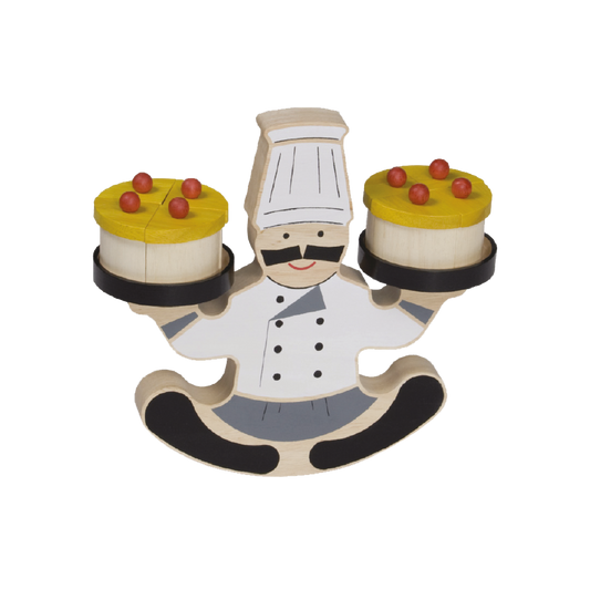 A wooden toy balancing game featuring a cartoon chef with a moustache in a kneeling position, holding two cakes with the left and right hands, and decorated with faux pastry and cherries on top.