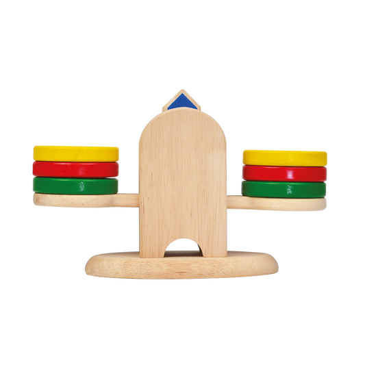 A wooden balance scale with colorful discs on each side, designed for children's educational play.