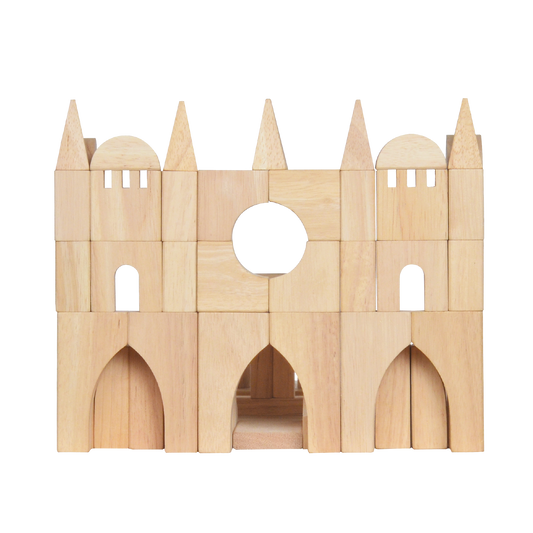 A wooden block construction representing a complex architectural structure with arched windows and a central circular opening.