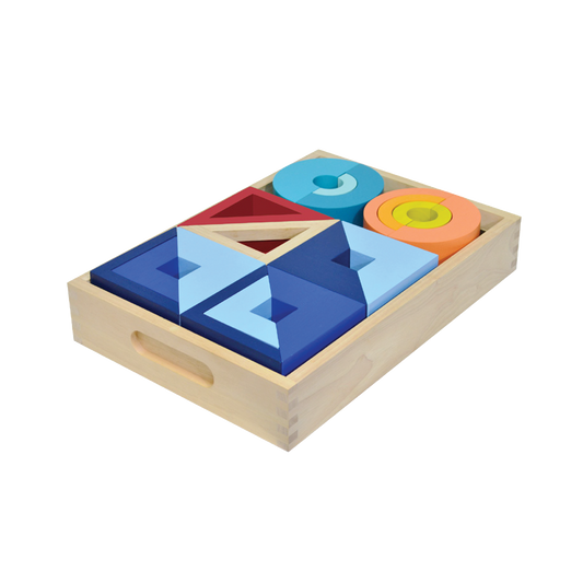 A set of colorful geometric blocks in a wooden tray, featuring shapes like squares, triangles, and circles.