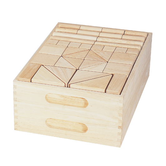 A set of wooden unit blocks arranged in a pattern inside a wooden box with handles.