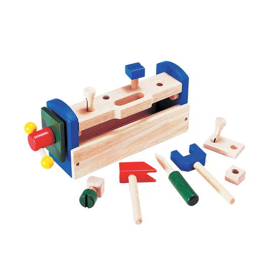 A colorful wooden tool box with various tools spilling out, including a hammer, screwdriver, wrench, and vise.
