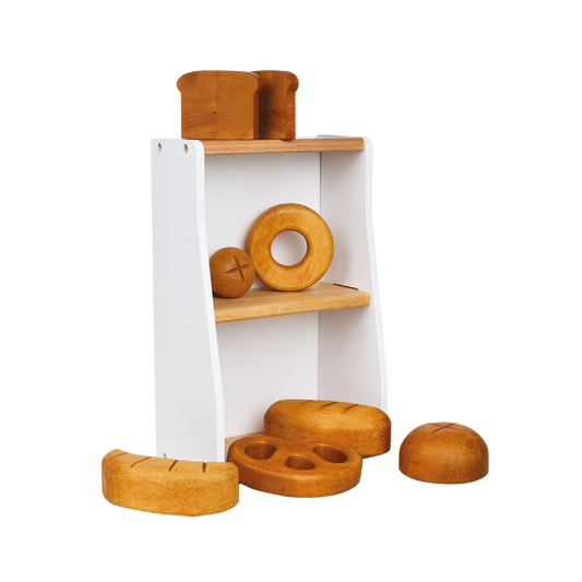 Wooden bakery crate with a white shelf on top, containing various wooden toy breads and pastries.
