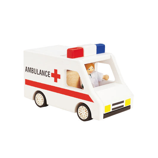A toy ambulance with a doll inside, featuring red and white colors with the text 'AMBULANCE' on the side.