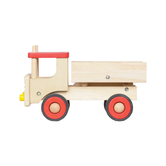 A wooden dump truck toy with red wheels and a beige body.